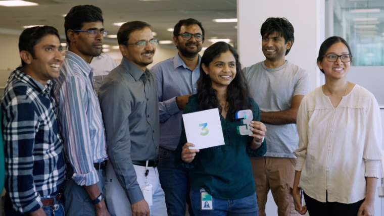 Employees gathered together for a work anniversary celebration