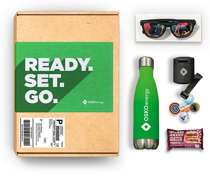 Company branded swag box with a variety of gifts