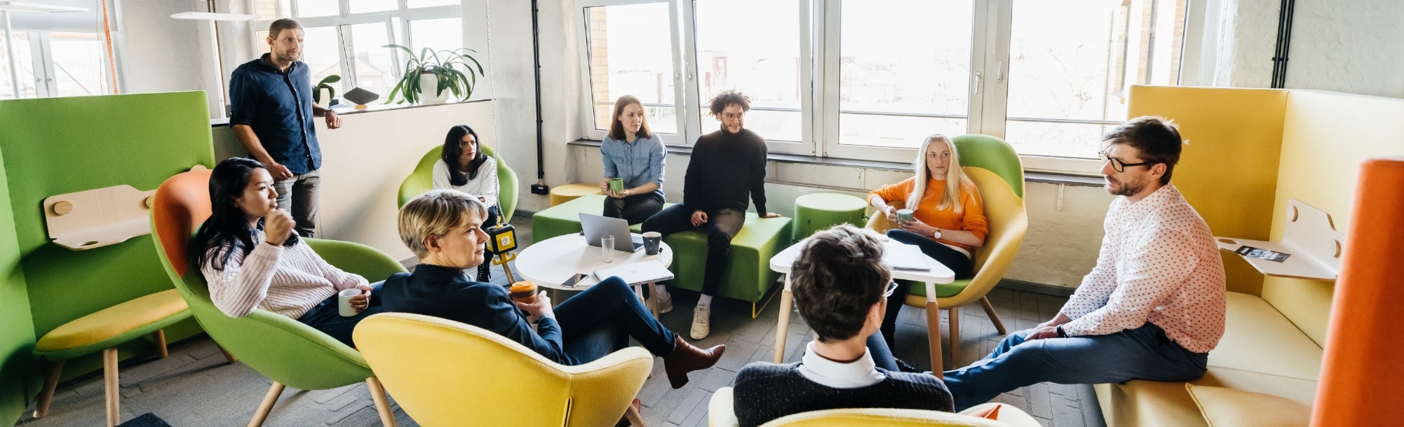 Diverse group of employees in a meeting together