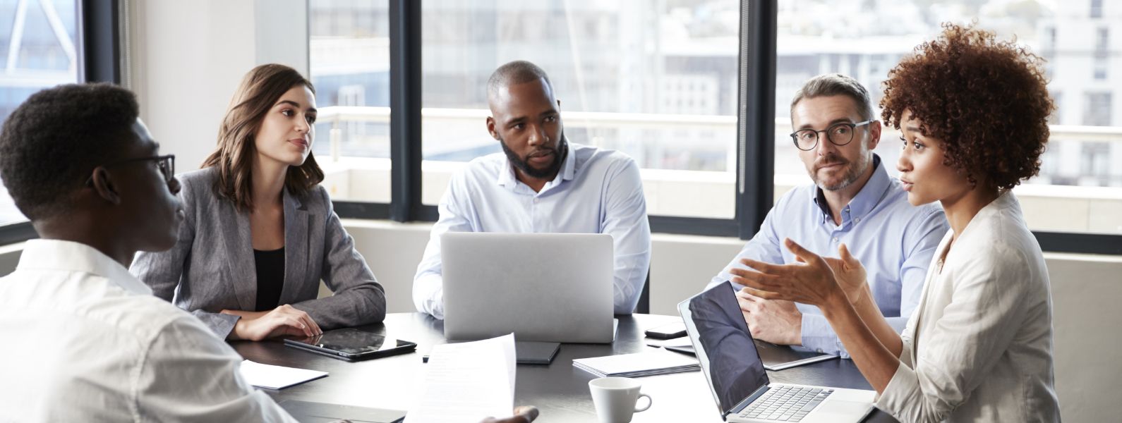Diverse group of employees in a meeting together