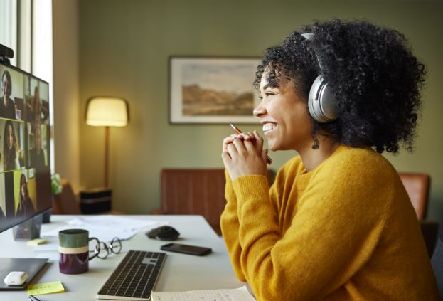 A remote employee calling into a team meeting from their home office.