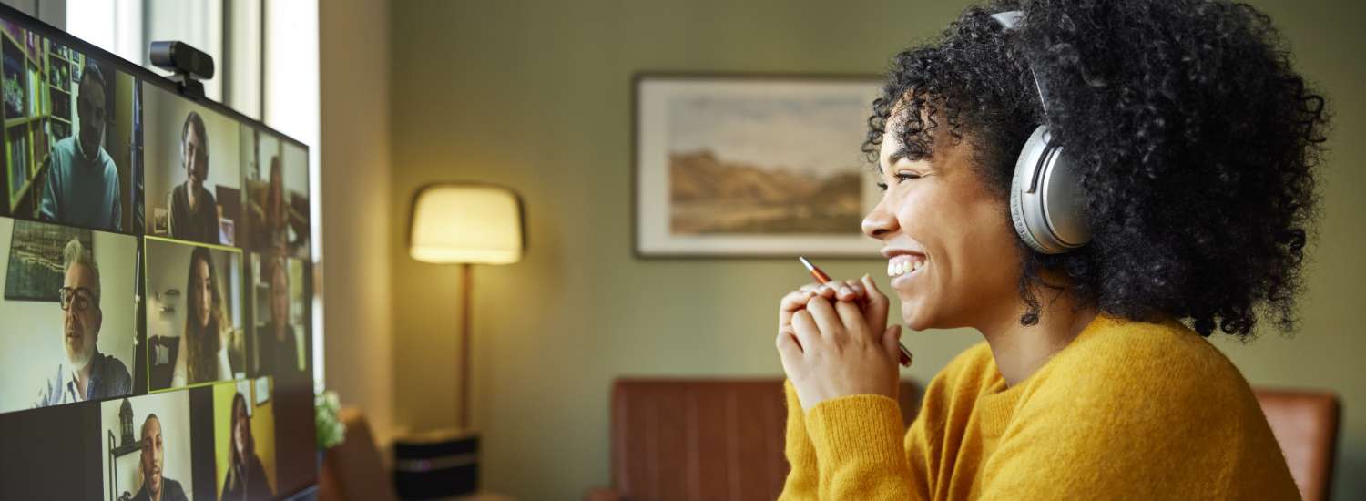 A remote employee calling into a team meeting from their home office.