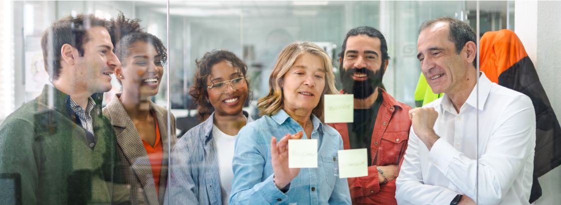 Employees reviewing ideas in a meeting