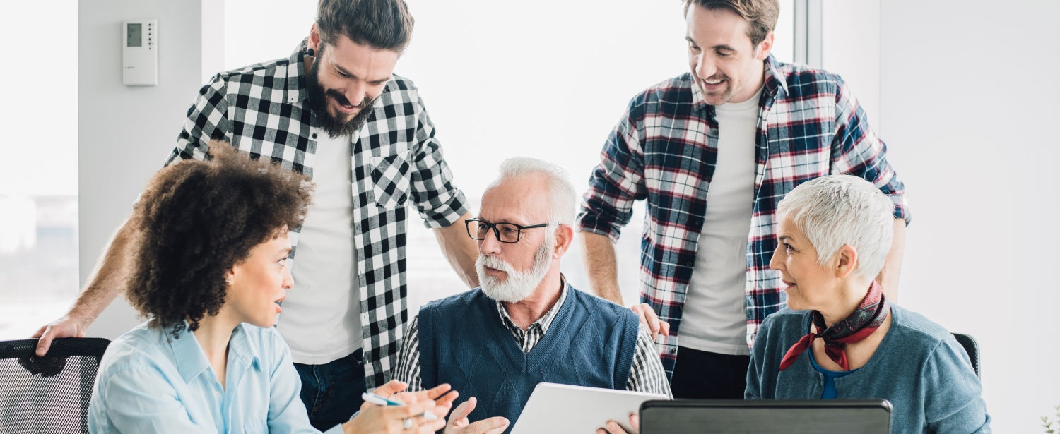 Multigenerational workforce collaborating together.