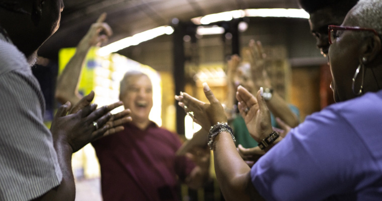Manufacturing workers celebrating together
