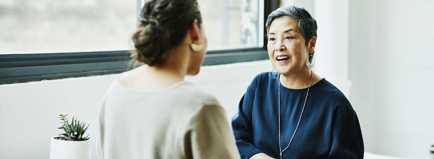 An employee and a manager in a one on one meeting