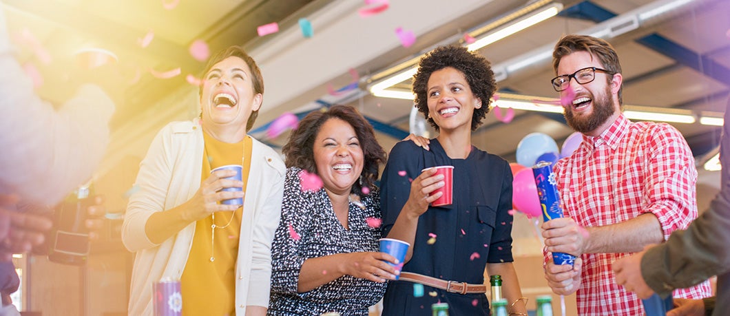 Smiling businesspeople at an office party