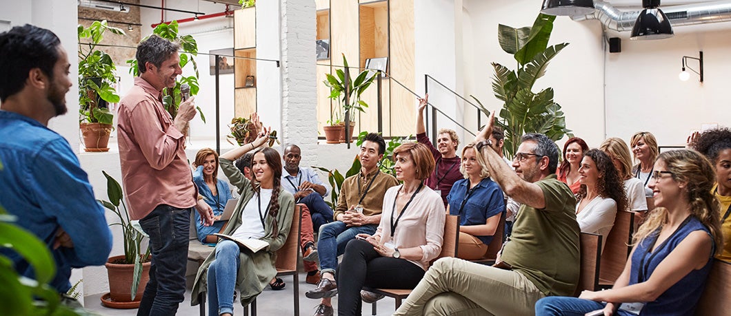 Businesspeople gathered in a conference room