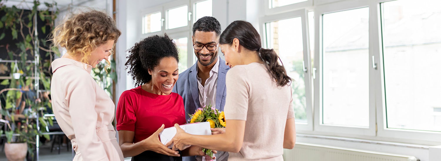 Coworkers celebrating in an office.