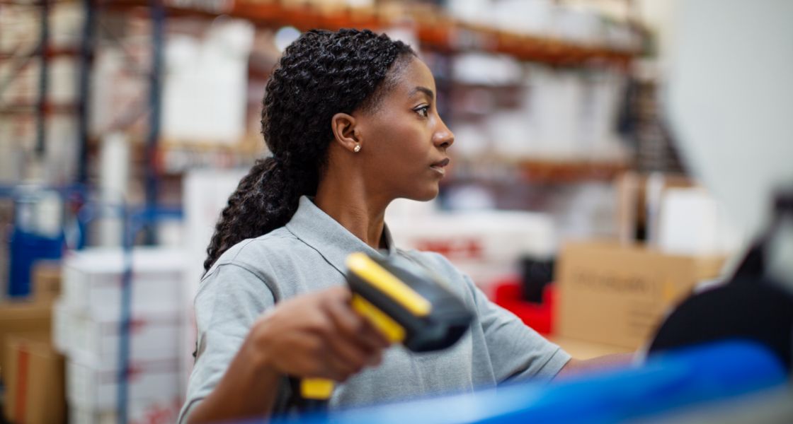 Deskless warehouse employee scanning shipments