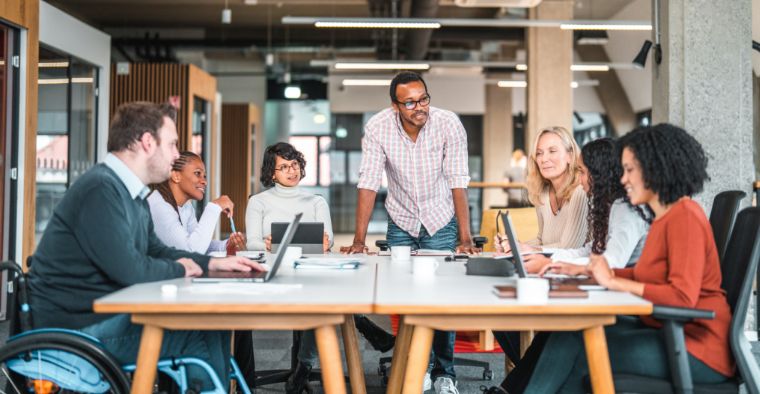 A team holding a huddle in an office