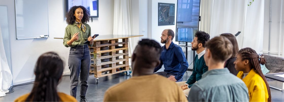 A manager leading a training for employees.