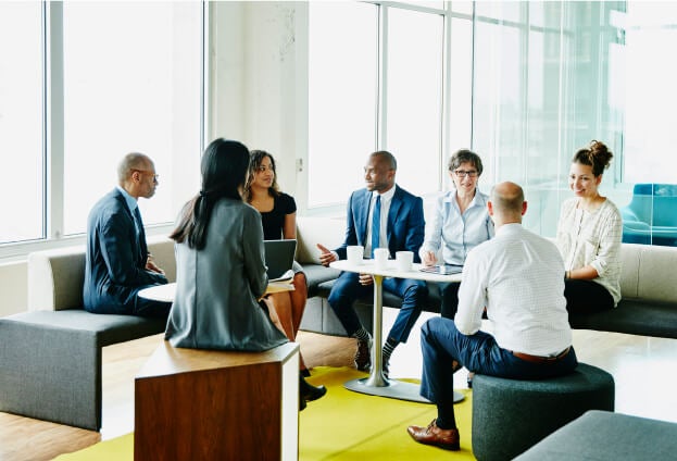 Diverse group of employees in a meeting together