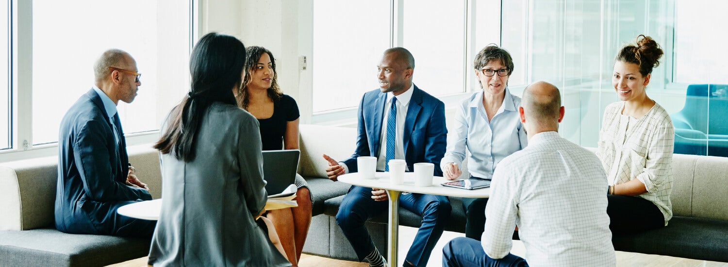 Diverse group of employees in a meeting together