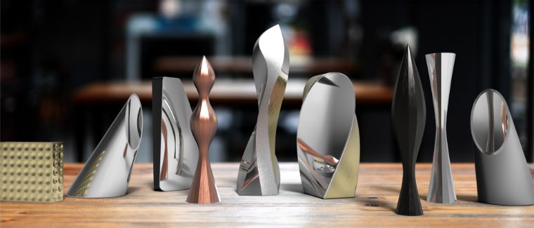 A display of unique, aluminum symbolic awards with various organic shapes
