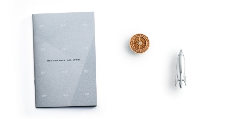 O.C. Tanner’s custom pins for service and a brochure explaining each symbol