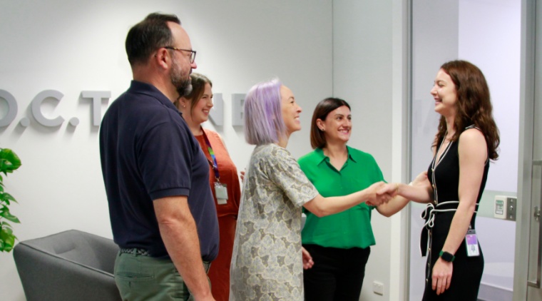 O.C. Tanner Asia Pacific employees welcoming a new teammate to the office