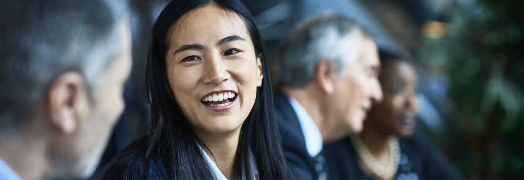 An engineer uses a computer to view data in a factory