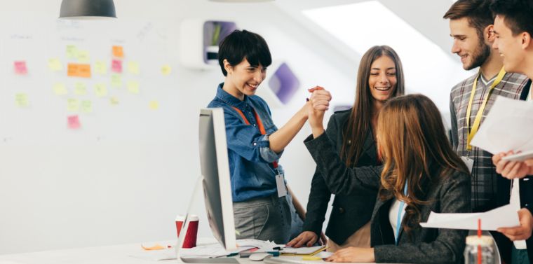 Employees celebrating in an office