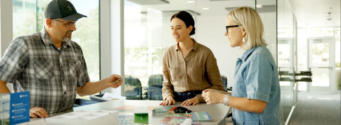 O.C. Tanner designers reviewing recognition materials for a client