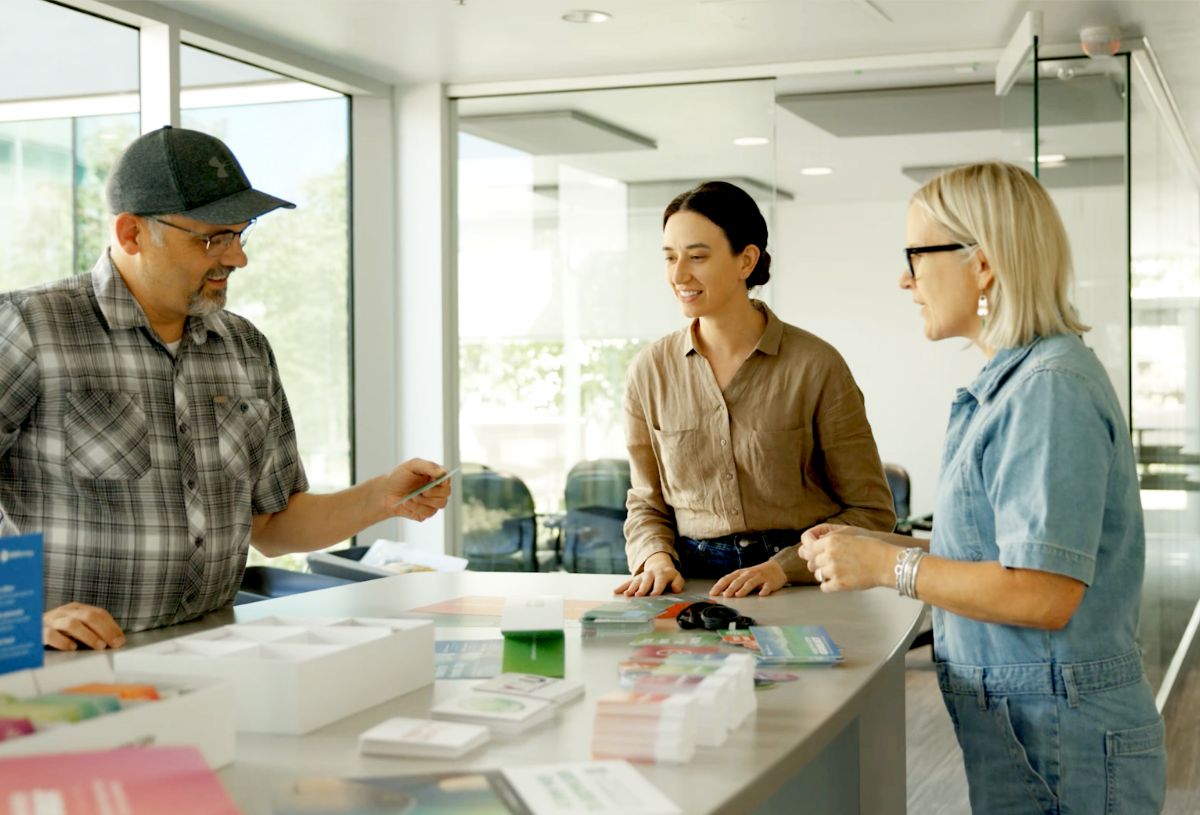 O.C. Tanner designers reviewing recognition materials for a client