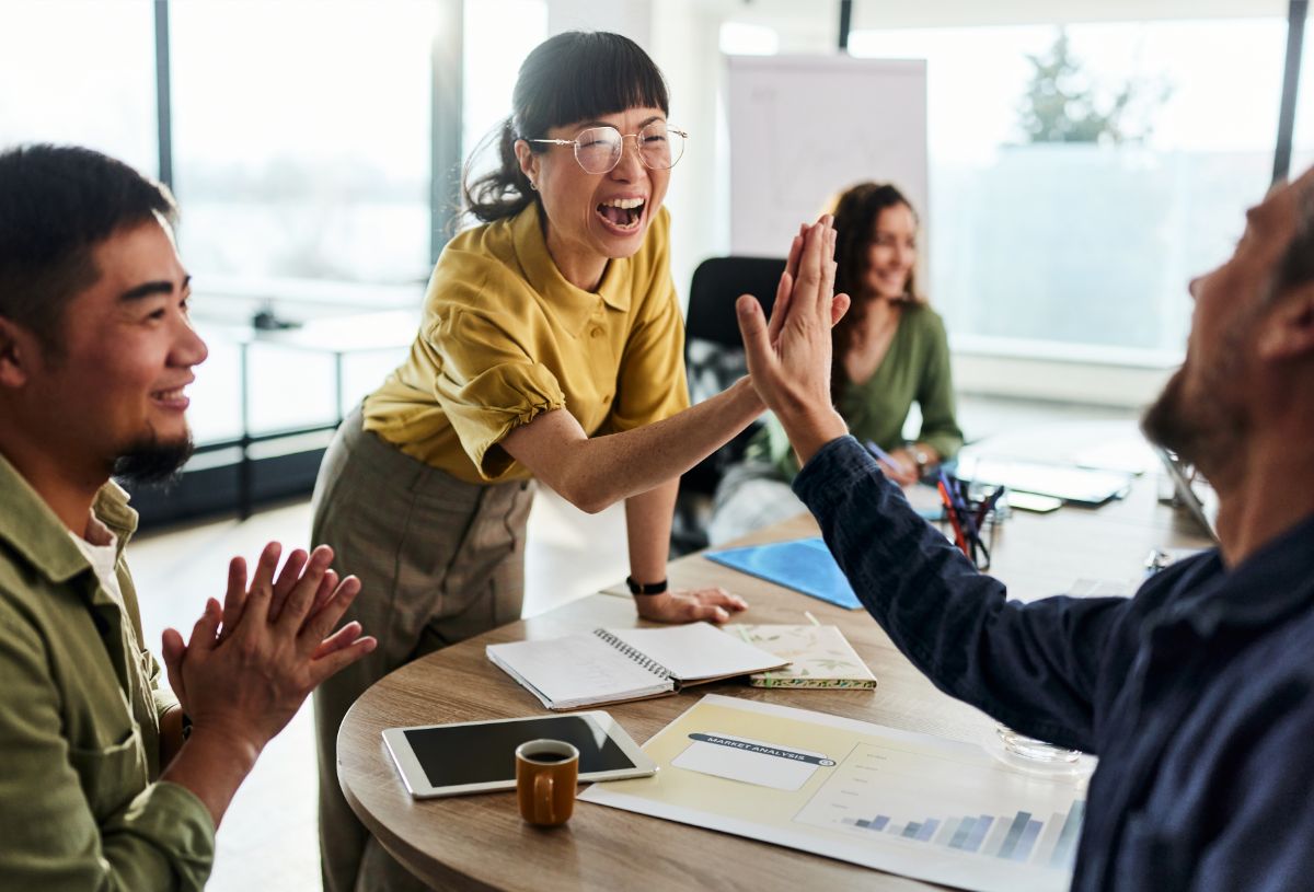 Employees in an office celebrating together