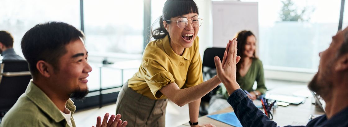 Employees in an office celebrating together