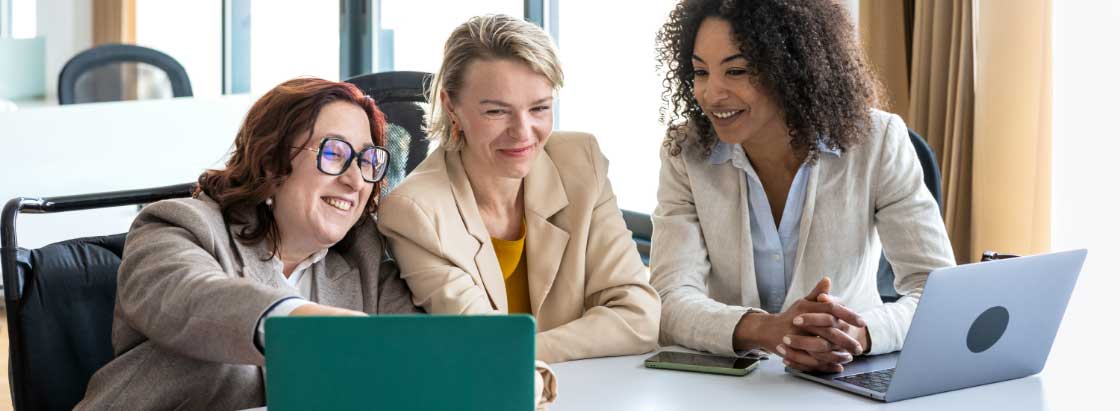 Employees looking at their laptops