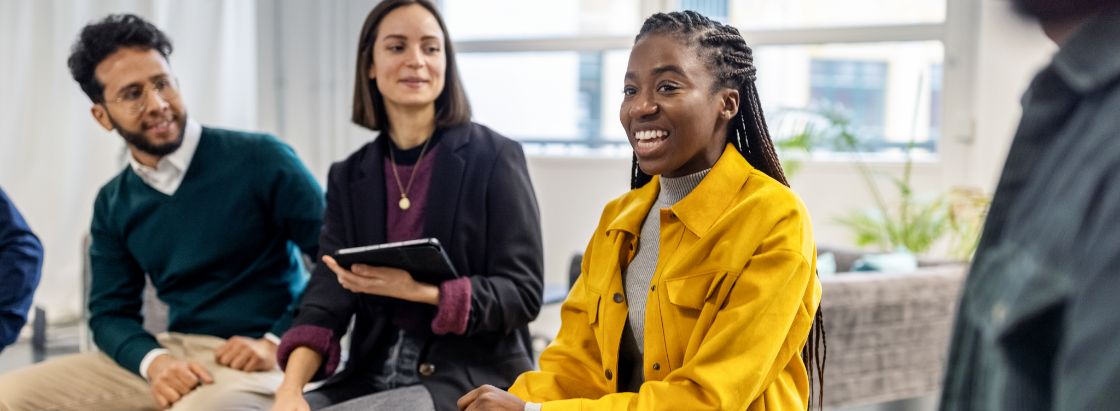 An employee talking in a meeting