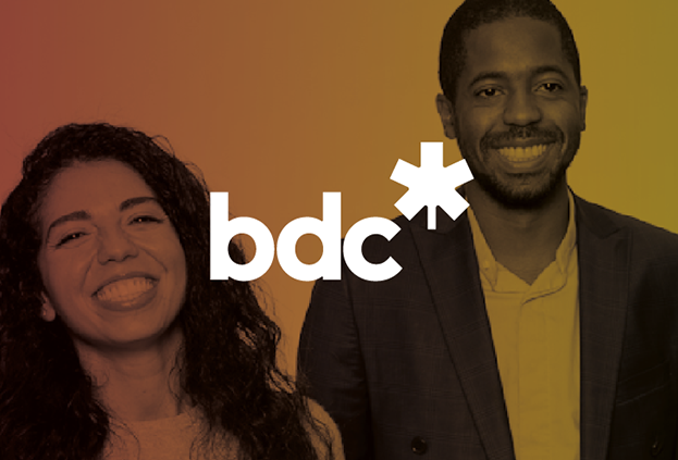 A group of employees smiling