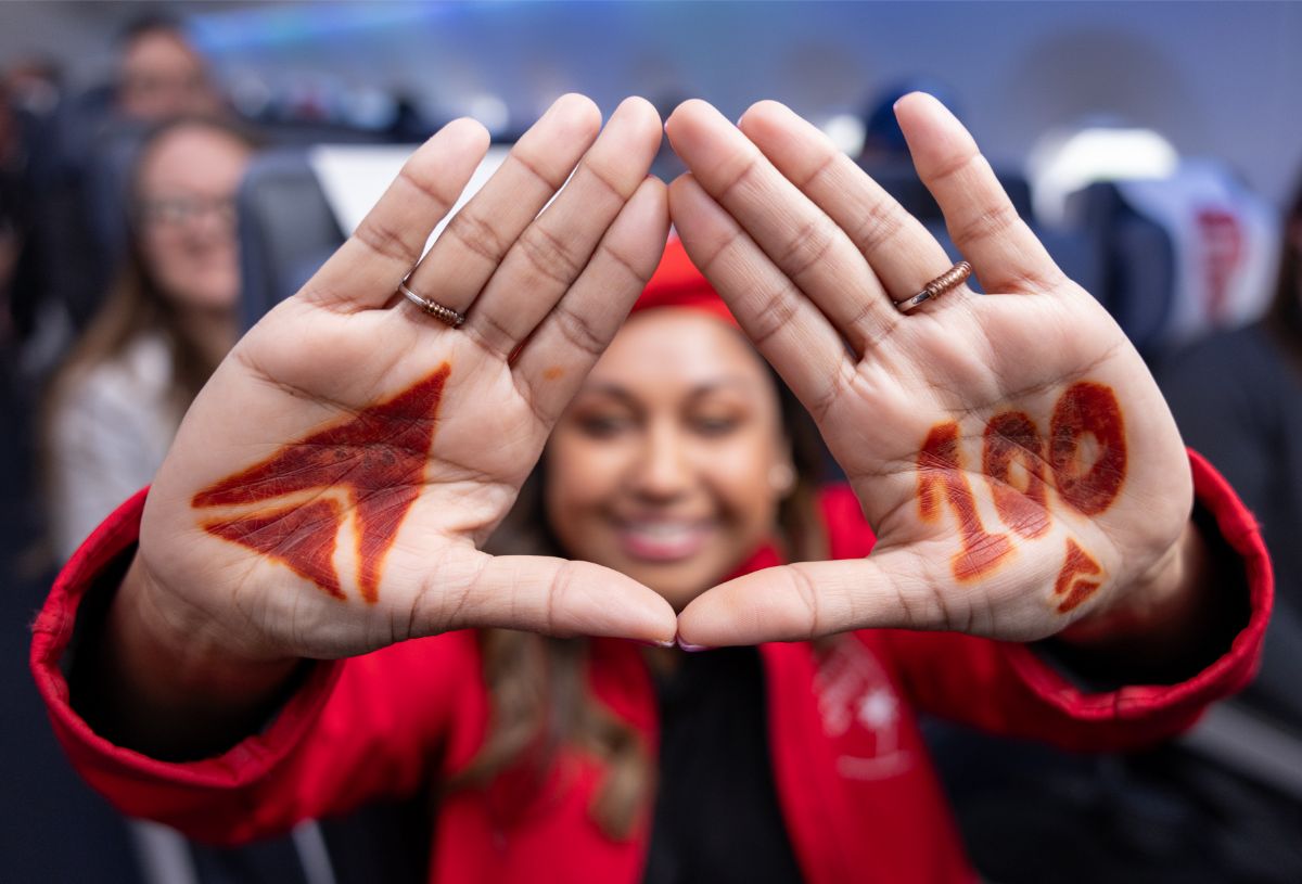 Delta employee celebrating the 100-year anniversary of the company.
