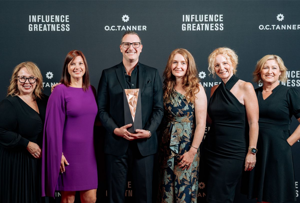 ACE employee recognition leaders accepting the Breakthrough Award at O.C. Tanner’s Influence Greatness conference.