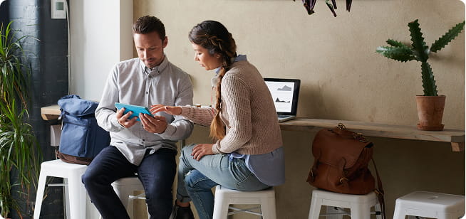 Remote employees working in a cafe together