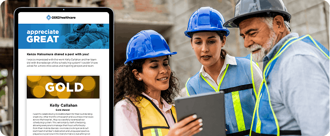 Utilities employees looking at a tablet with a recognition award nomination Broadcast.