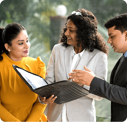 Employees reviewing a portfolio together