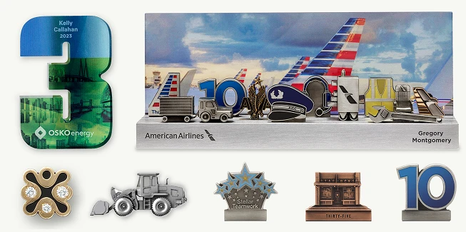 A selection of custom, symbolic awards, like Careerscapes and numerals, designed and crafted by O.C. Tanner to help companies celebrate career milestones.