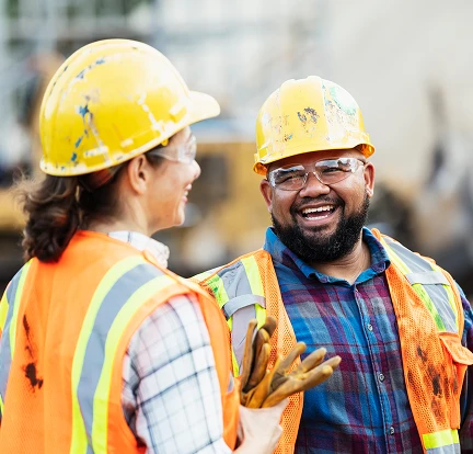 A group of construction workers wearing hard hats