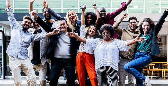 Employees celebrating in an office building