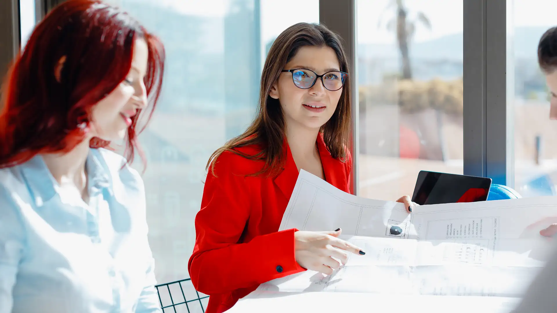 A woman leading a meeting in a modern office