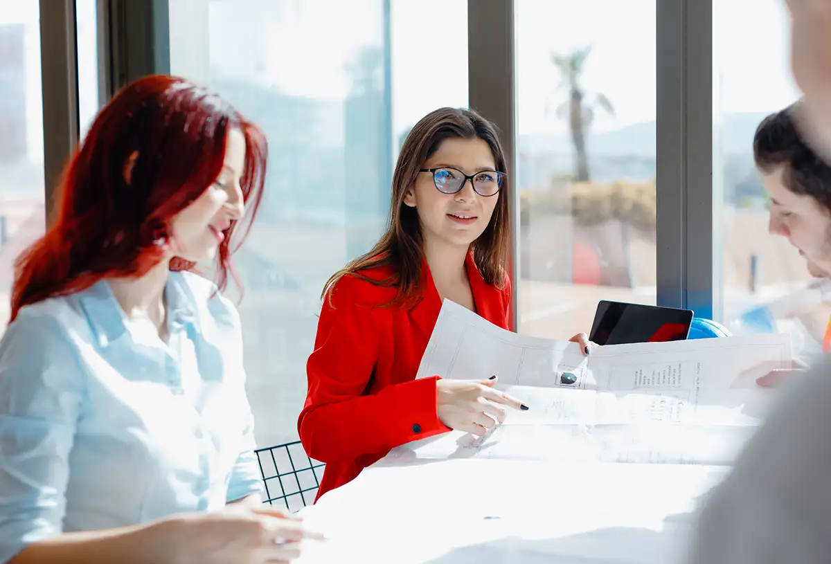 A woman leading a meeting in a modern office