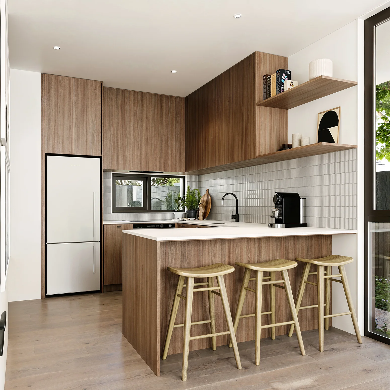 Modern kitchen with wood cabinets, white countertops, three wooden stools, and a coffee machine.