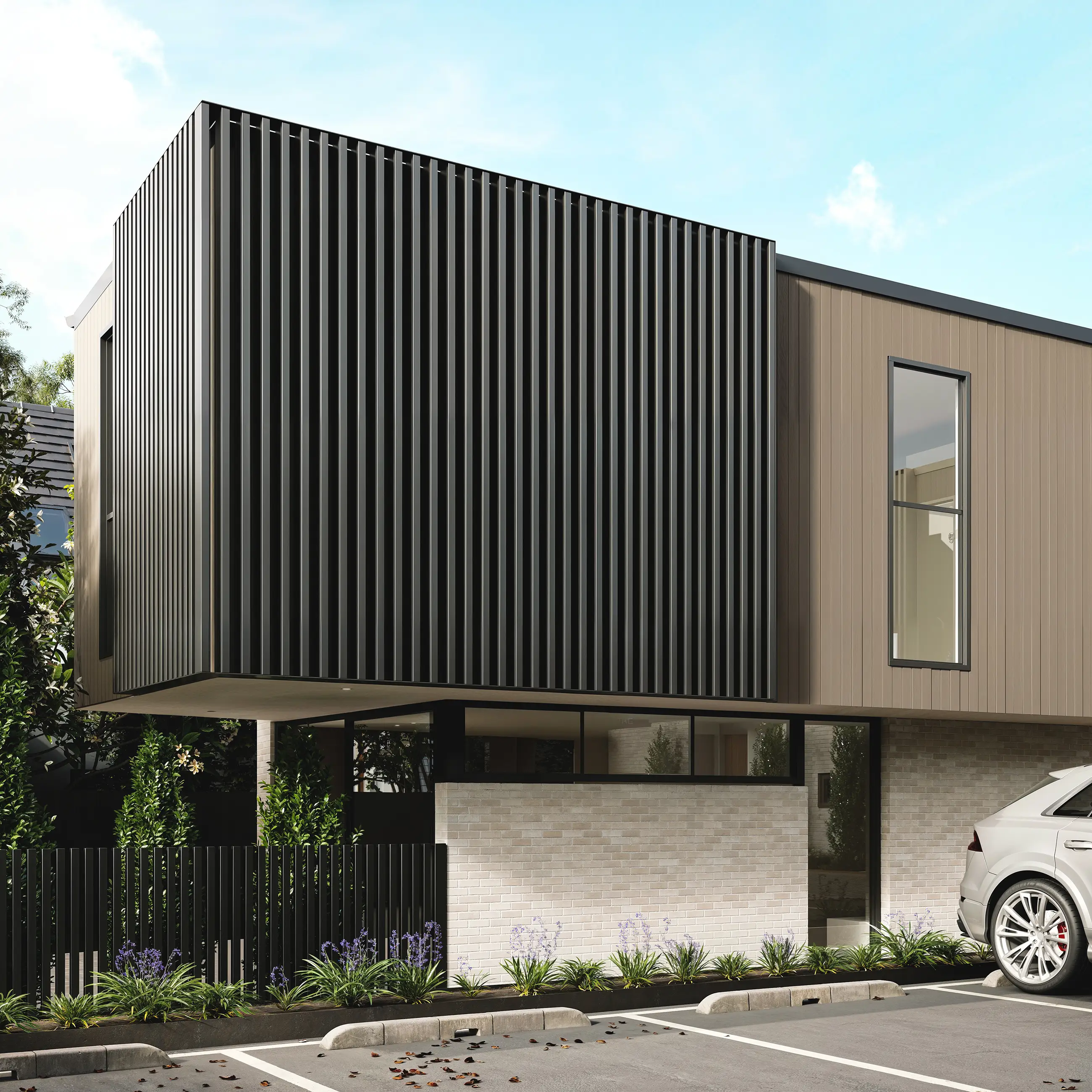 Modern house exterior with black vertical paneling, beige siding, brick base, and a parked gray car.