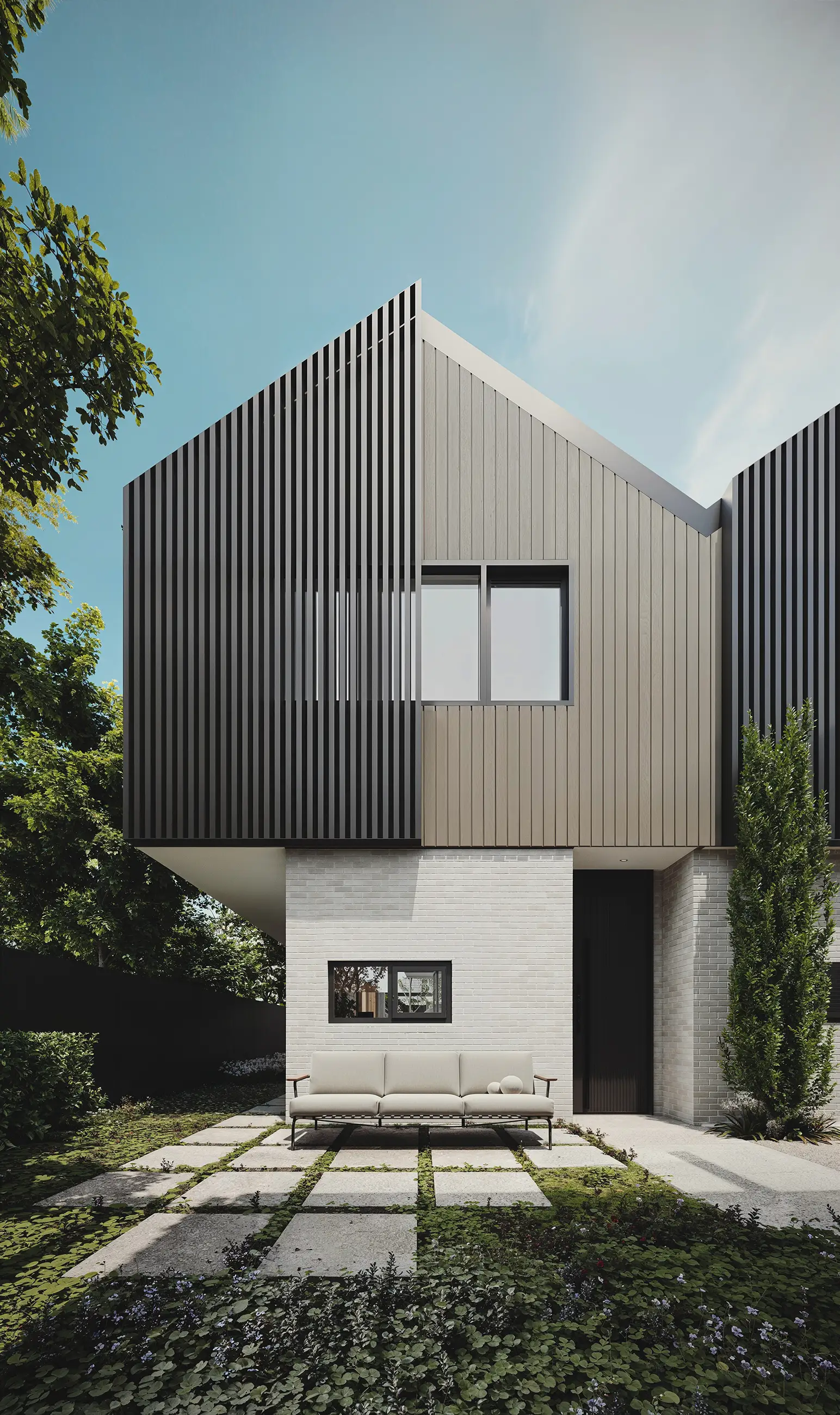 Modern two-story house with vertical wood and metal siding, a front patio, and an outdoor sofa.