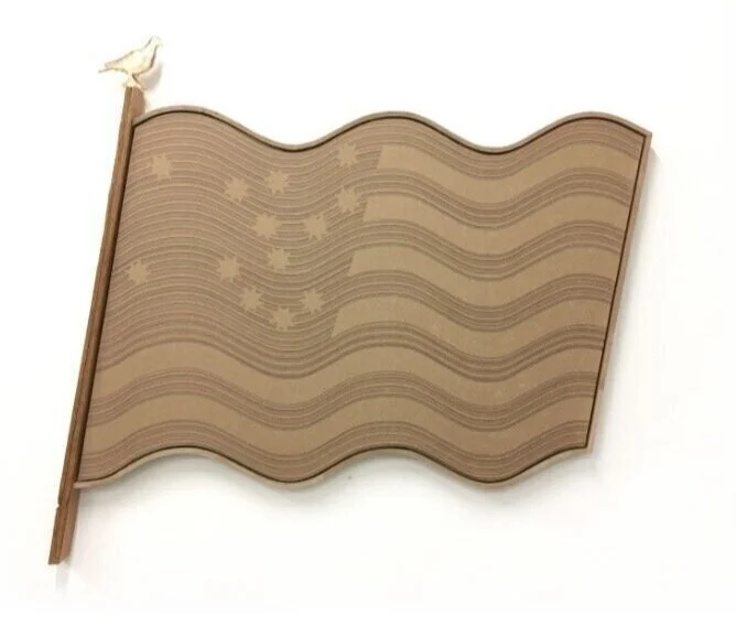 LYNDON BARROIS JR, Brown Paper Flag Test Ink (2017) Butcher paper, laser print, enamel pin, chipboard and cedar frame, 24 x 42in, Courtesy of Rubber Factory