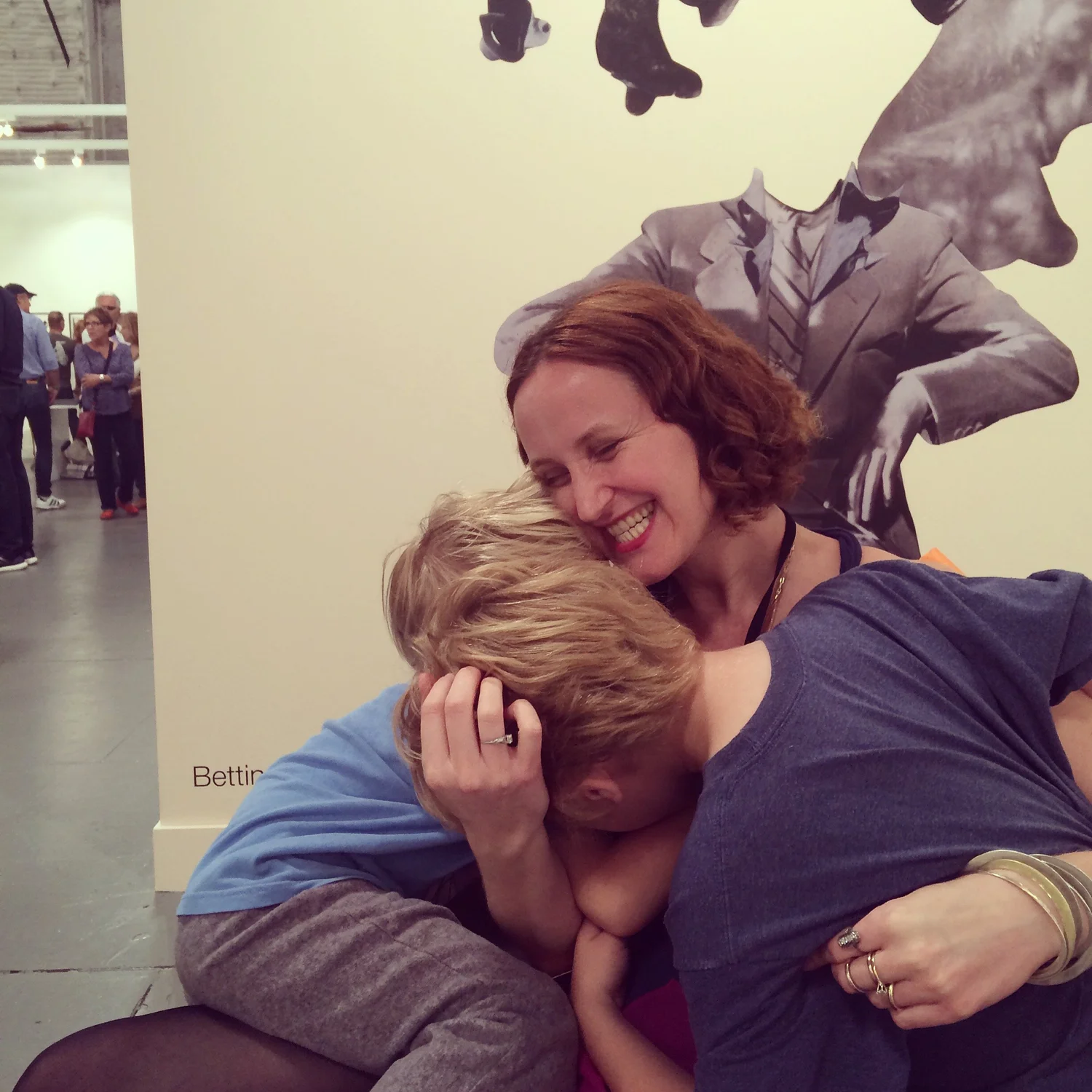 Deb Klowden Mann at Paris Photo LA with her boys, 2015 in front of Bettina Hubby’s work.
