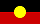 Aboriginal flag with a horizontal black and red background and a central yellow circle.