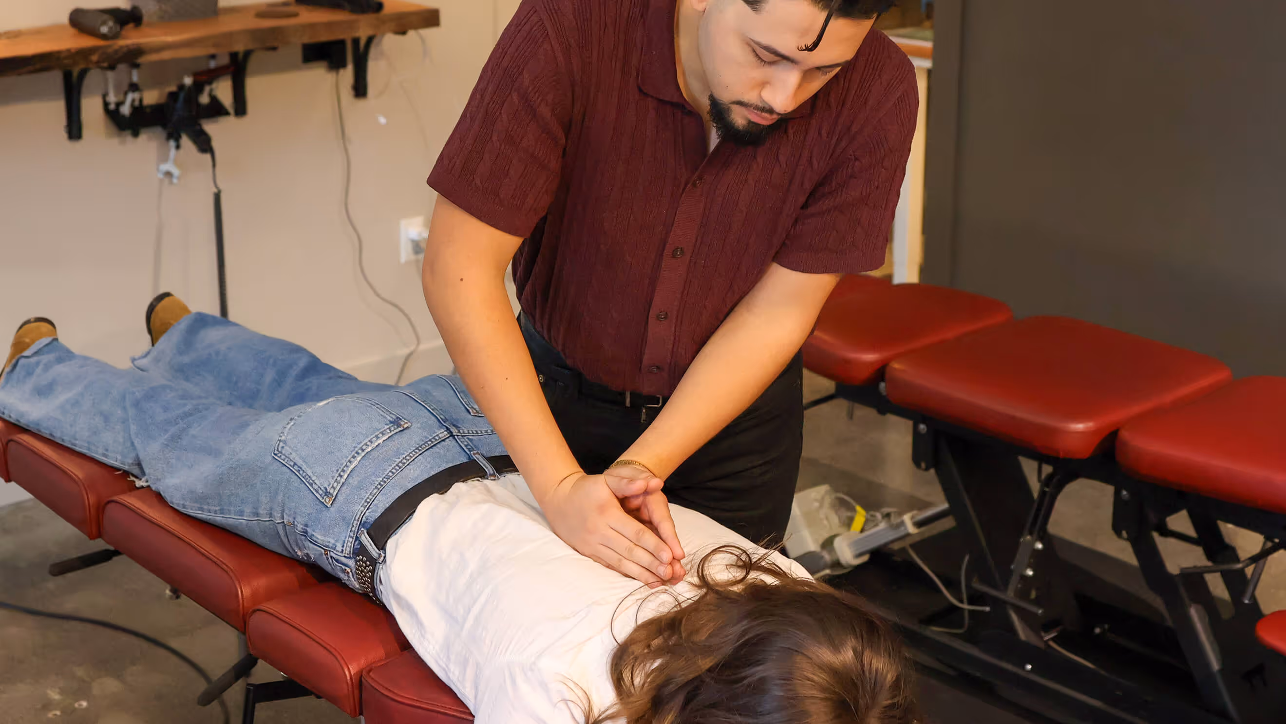 Inside Thrive Wellness Center treatment area with professional chiropractic equipment