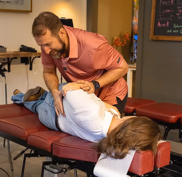 Auto accident injury patient receiving chiropractic examination and treatment assessment