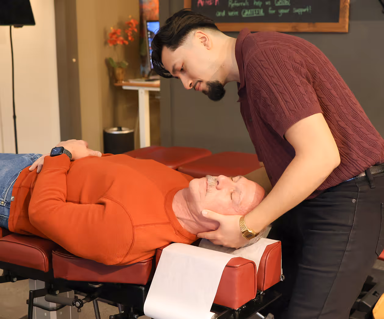 Patient performing physical rehabilitation exercises with guided functional movement training at Thrive Wellness Center