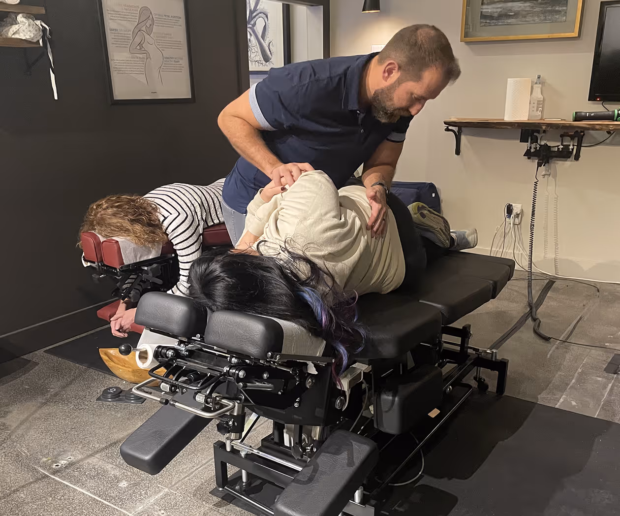 Pregnant woman receiving gentle prenatal chiropractic care for comfort and spinal alignment